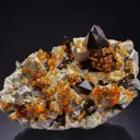 Spessartine on Smoky Quartz on Microcline - image 1