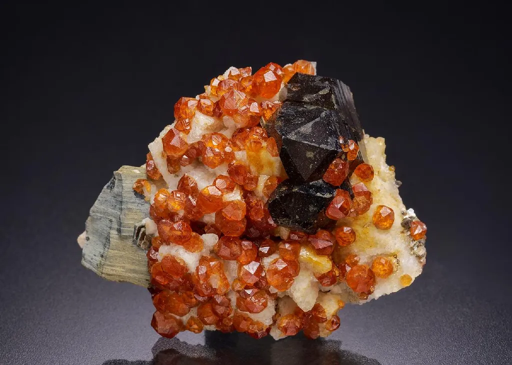 Spessartine with Smoky Quartz and Muscovite image