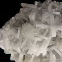 Strontianite (fl) on Baryte on Fluorite - image 1