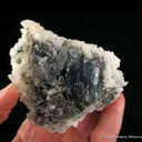 Strontianite (fl) on Baryte on Fluorite - image 3