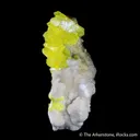 Sulphur (rare sphenoidal habit) on Calcite - image 4