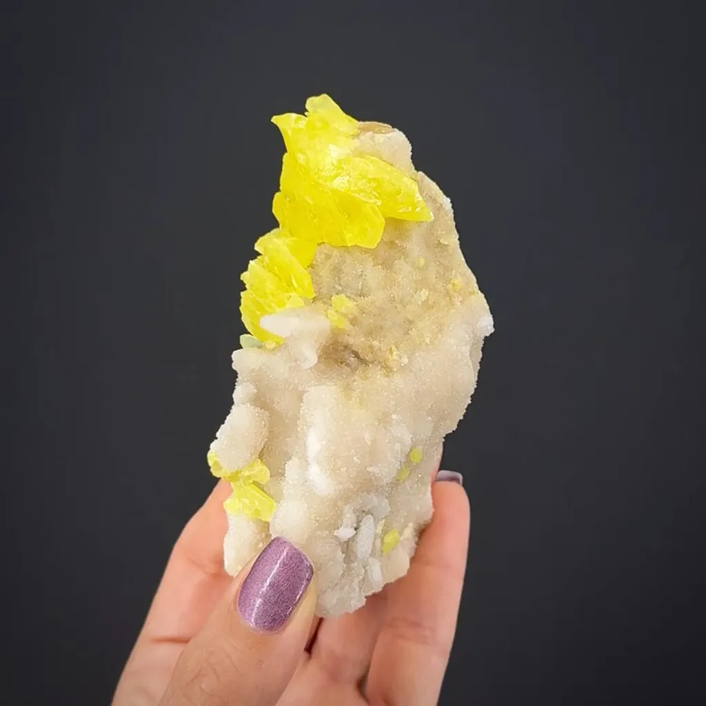Sulphur (rare sphenoidal habit) on Calcite - image 2