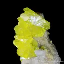 Sulphur (rare sphenoidal habit) on Calcite - image 1