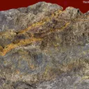 Suredaite (type locality) with Wurtzite, Sphalerite, Pyrite, and Coiraite (?) - image 1