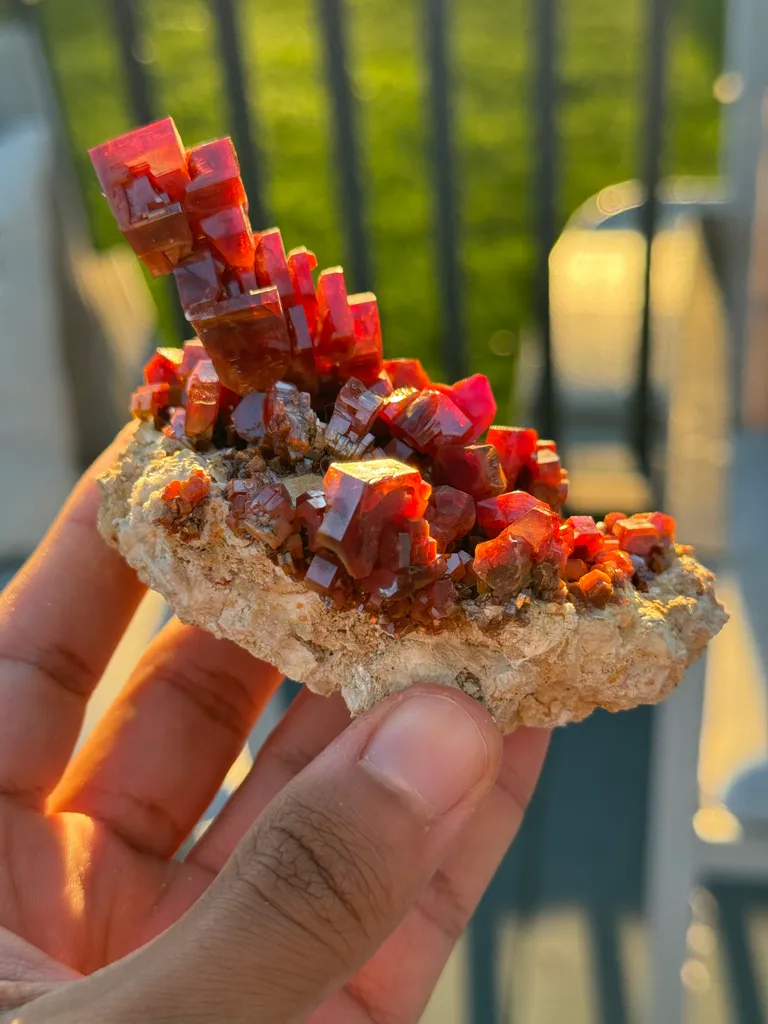 This exceptional vanadinite specimen is a masterpiece of natural artistry, featuring a unique format image