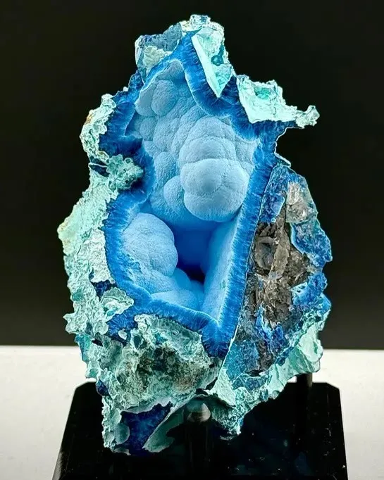 This surreal Shattuckite specimen features a striking open cavern lined with… image