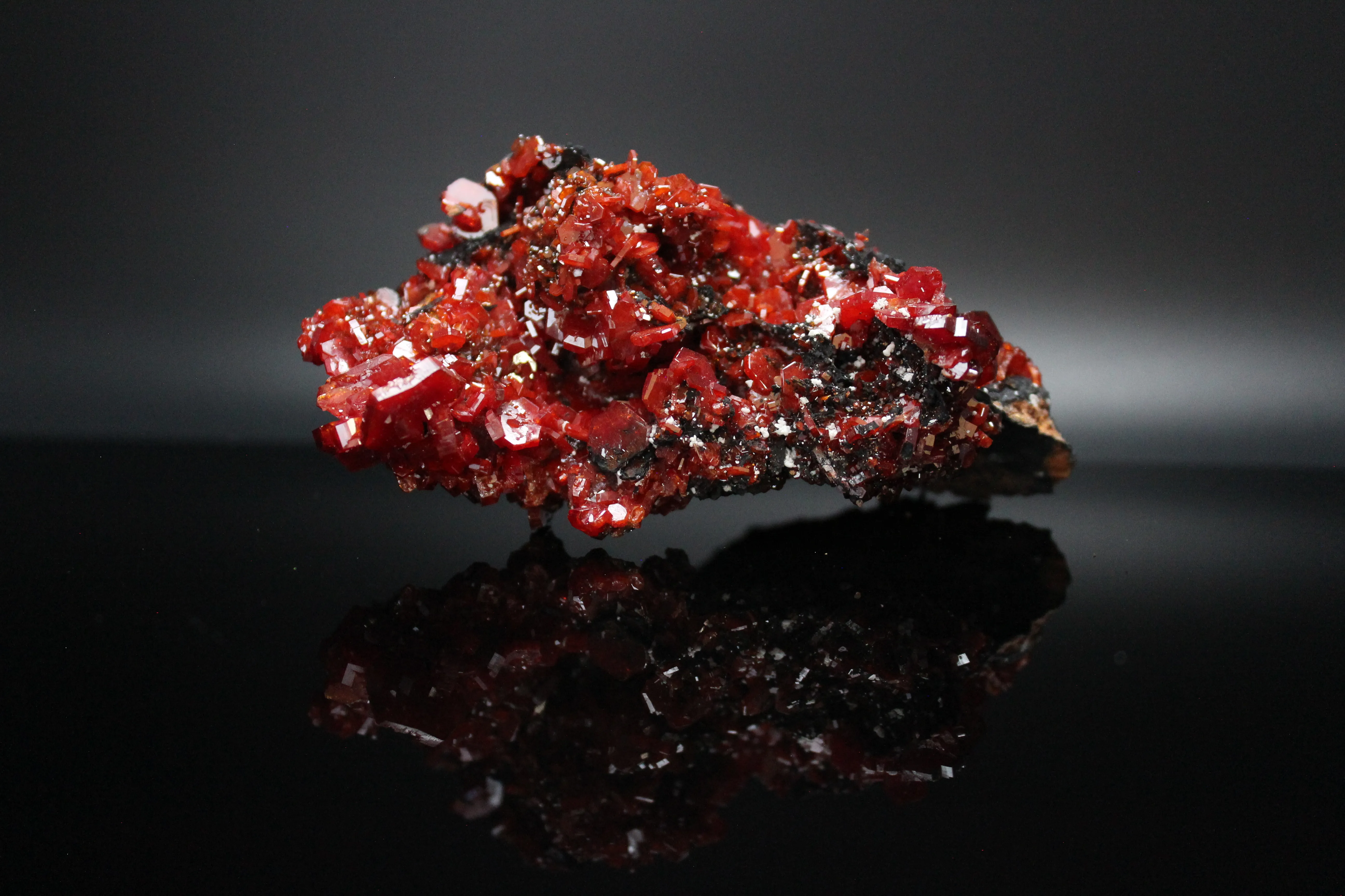 Vanadanite Crystals on black (manganese?) host rock - image 2
