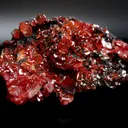 Vanadanite Crystals on black (manganese?) host rock - image 1