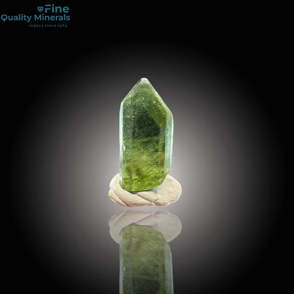 Vibrant Peridot Crystal with Rutile Inclusions image