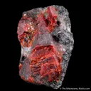 Zincite (co-type locality) on Franklinite - image 1